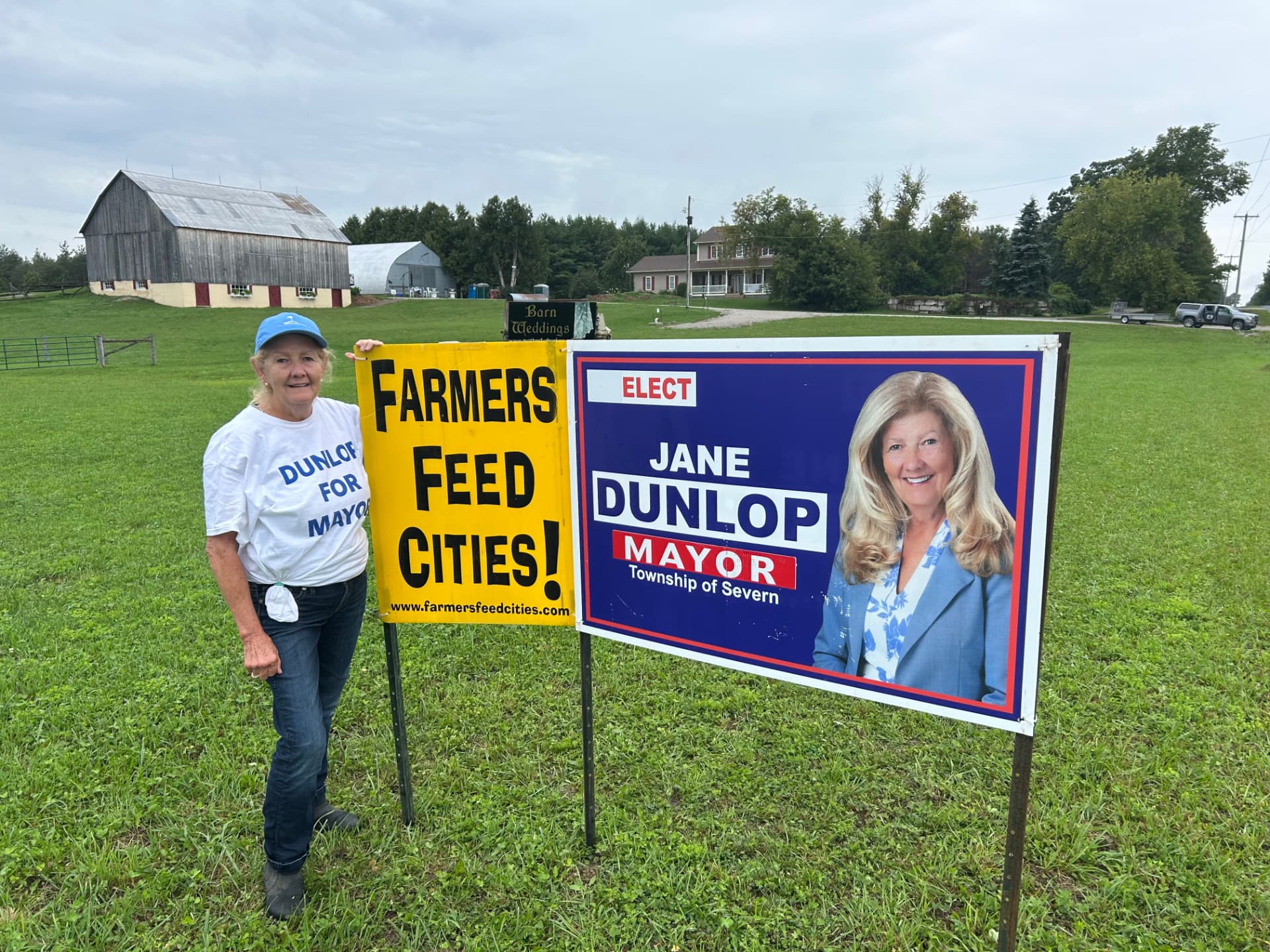 Jane Dunlop with her campaign sign on the trail in Severn Township
